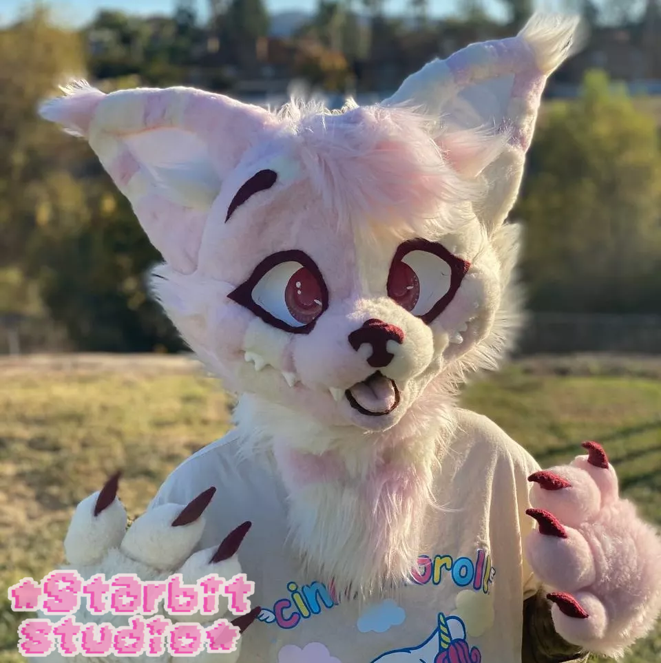 Cute pink and cream split feline fursuit in a western style.